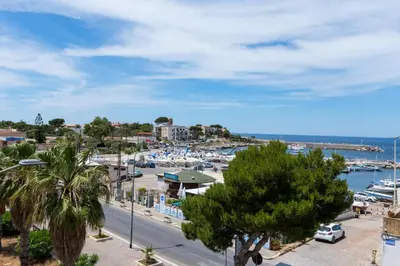 a view of a harbor with boats in a marina at La Casetta sul Mare in Isola delle Femmine