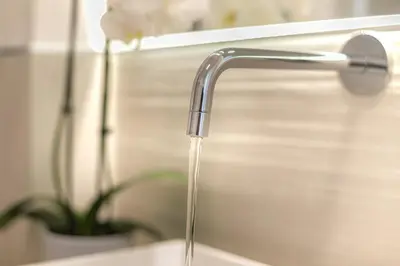 a kitchen sink with a water faucet at La Home42 Suite in Palermo