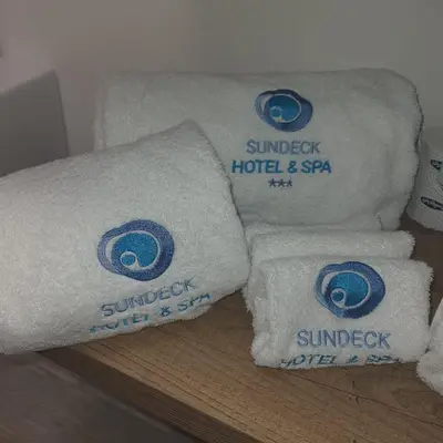 a pile of towels sitting on a shelf at Sundeck Hotel in San Vito lo Capo