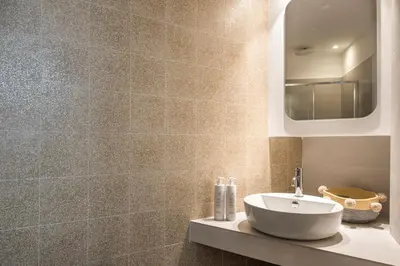 a bathroom with a sink and a mirror at Le Niche Holiday Homes by Wonderful Italy in Palermo