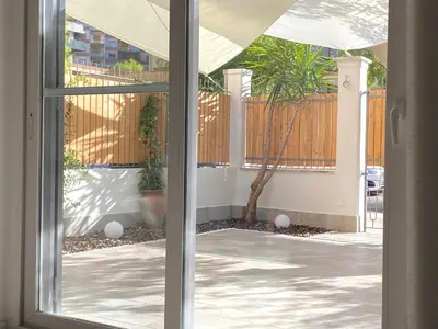 a sliding glass door with a view of a patio at casa vacanze Sleep Art in Palermo