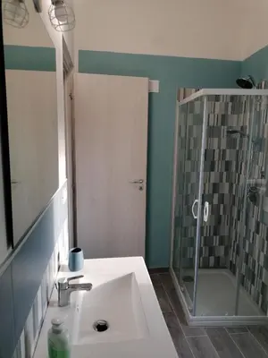 a bathroom with a sink and a shower at La terrazza sul vicolo in Palermo