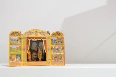 a model of a shrine with paintings on it at M'Place Apartments in Palermo