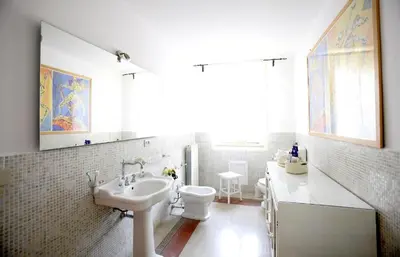 a white bathroom with a sink and a toilet at CUBA'S ART HOUSE in Palermo