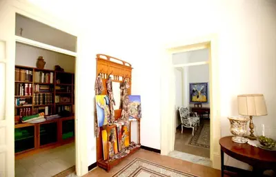 a hallway with a room with a dining room at CUBA'S ART HOUSE in Palermo