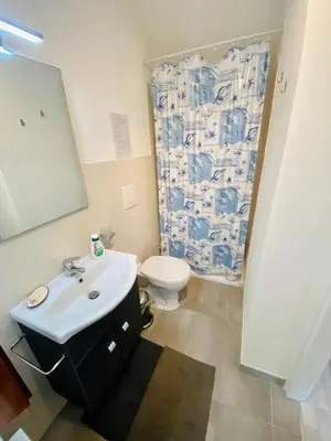 a bathroom with a sink and a toilet and a shower at VILLA OASI a 50 mt dalla spiaggia in Alcamo Marina