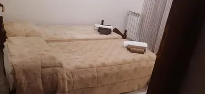 a bedroom with two beds in a room at Villa Cavalluccio Marino con piscina idromassaggio in Carini