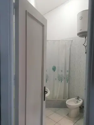 a bathroom with a toilet and a shower curtain at Casa Giusi in Sferracavallo