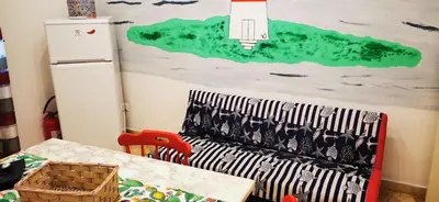a room with a table and a painting on the wall at Casa Giusi in Sferracavallo
