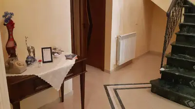 a room with a table with a guitar on it at Carini Luxury Apartment vicino aereoporto e al mare in Carini