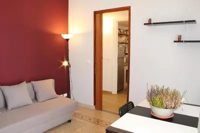 a living room with a couch and a table at Cosmo Apartment in Palermo
