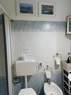 a bathroom with a toilet and a sink at Da Mari e Paolo in Palermo