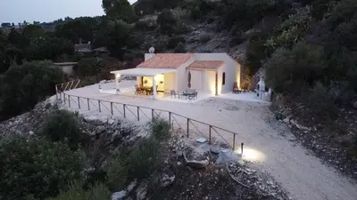 an aerial view of a small house on a hill at Villa Futura in Scopello