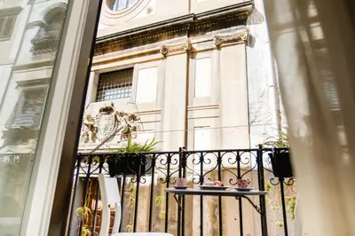 a balcony view of a building from a window at Appartamenti Maria Al Capo in Palermo
