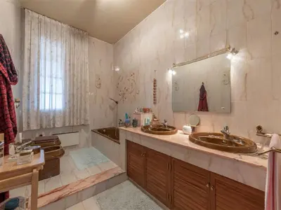 a bathroom with two sinks and a large mirror at Villa with Pool, Pets & WiFi in Misilmeri