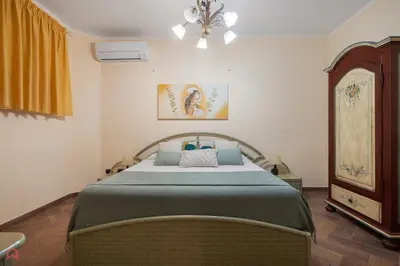 a bedroom with a large bed in a room at Panoramica Villa con Piscina sul Mare (Sanificata) in Cinisi