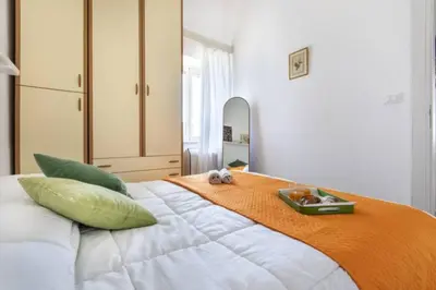 a bedroom with a bed with a tray on it at villa Sun in Alcamo