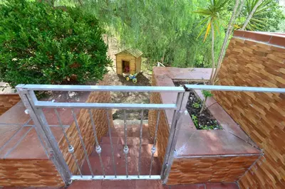 an aerial view of a balcony with a dog house at Villa Trappeto in Trappeto
