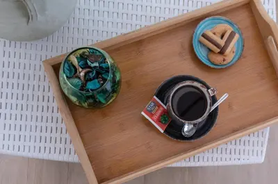 a tray with a cup of coffee and cookies at Meridiana B&B in Palermo