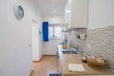 a kitchen with a sink and a counter top at Ncantu home in Palermo