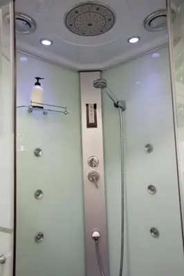 a shower in a bathroom with a ceiling at Villa Silvia by Ville in Palermo in Casteldaccia