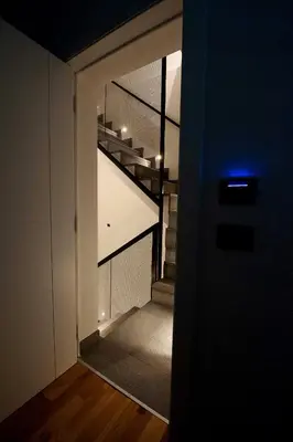 a hallway with a spiral staircase in a house at Palazzo al Carmine in Monreale