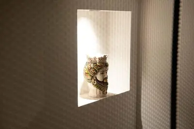 a picture of a statue of a head with a crown at Palazzo al Carmine in Monreale