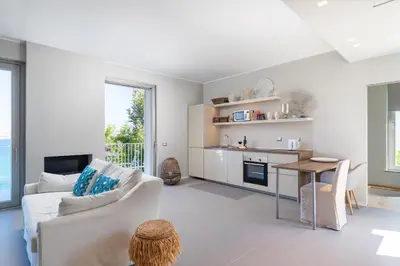 a living room with a couch and a table at NESOS SUITE by DomuSicily in Mondello