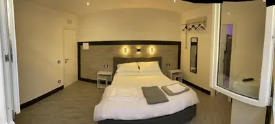 a bedroom with a large bed in a room at LA CASA DELLE FATE-Area Marina Protetta in Isola delle Femmine