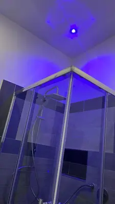 a bathroom with a shower with a purple ceiling at LA CASA DELLE FATE-Area Marina Protetta in Isola delle Femmine