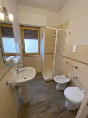 a bathroom with a sink and a toilet and a shower at BONORUM De Spuches in Palermo