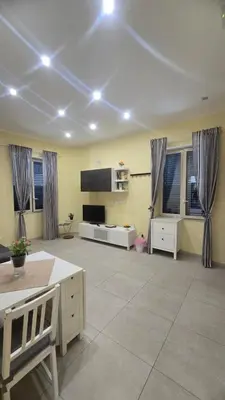 a large living room with a couch and a table at Casetta Delia in Palermo