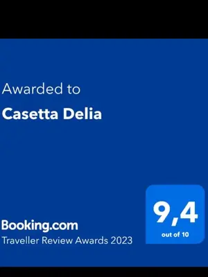 a screenshot of a cell phone with the text awarded to casica delia at Casetta Delia in Palermo