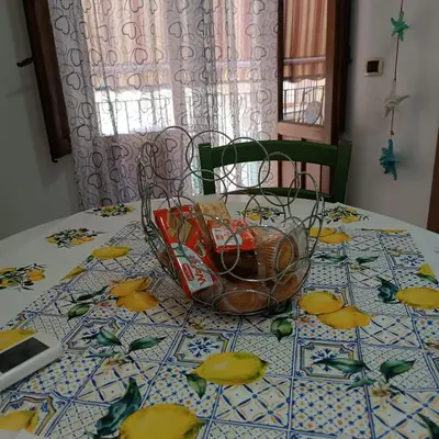 a table with a glass bowl on top of it at Sicilia bedda 1 in Isola delle Femmine