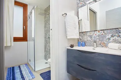 a bathroom with a sink and a shower at Villa Etesiae in Castellammare del Golfo