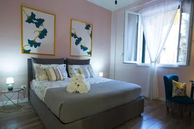 a bedroom with a bed with two stuffed animals on it at Casa del Capo in Palermo