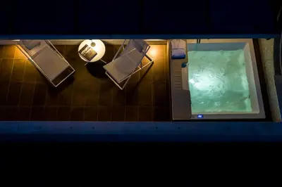 an overhead view of a bathroom with a swimming pool at Miceli Exclusive Suite in Palermo