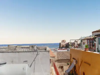 a view of the ocean from a building at Charming House in Castellammare del Golfo with Balcony in Castellammare del Golfo