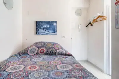 a bedroom with a bed in a room at Charming House in Castellammare del Golfo with Balcony in Castellammare del Golfo