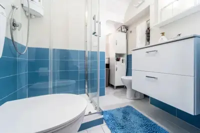 a bathroom with a shower and a toilet and a sink at Charming House in Castellammare del Golfo with Balcony in Castellammare del Golfo