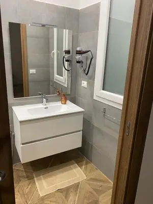 a bathroom with a sink and a mirror at DREAM CORLEONE ONE in Corleone