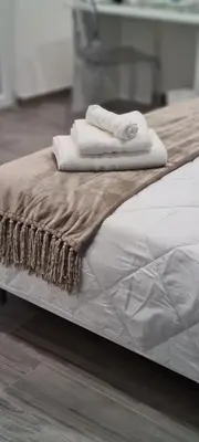 a bed with two towels on top of it at La Casa Di Amalia in Palermo