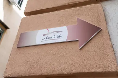 a sign on the side of a building at La Casa di Lilù in Palermo
