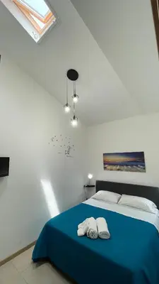 a bedroom with a bed with two towels on it at Casa vacanza 