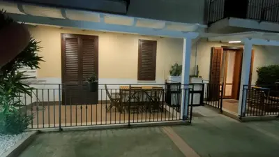 a balcony with a table and a fence at Stella del Mare San Vito Lo Capo in San Vito lo Capo
