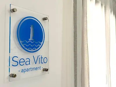 a sign for a sea vet appointment on a wall at Sea Vito Apartment in San Vito lo Capo