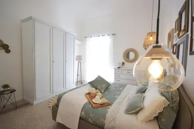 a bedroom with a bed with a bowl on it at La Casetta 90139 in Palermo