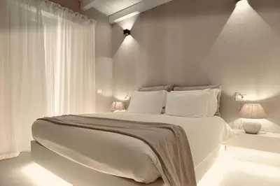 a bathroom with a sink and a phone on the wall at Palermo Inn Boutique Hotel in Palermo