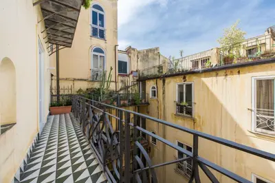 a balcony with a black and white checkered floor at Loft Trinacria con Vista Mare by Wonderful Italy in Palermo