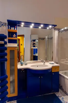 a bathroom with a sink and a large mirror at POLICLINICO HOME in Palermo